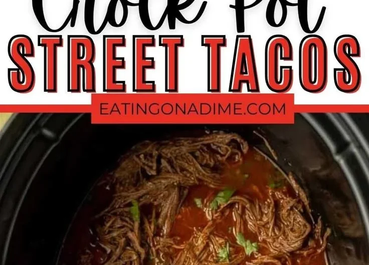 Delicious crock pot street tacos in a serving dish with toppings.