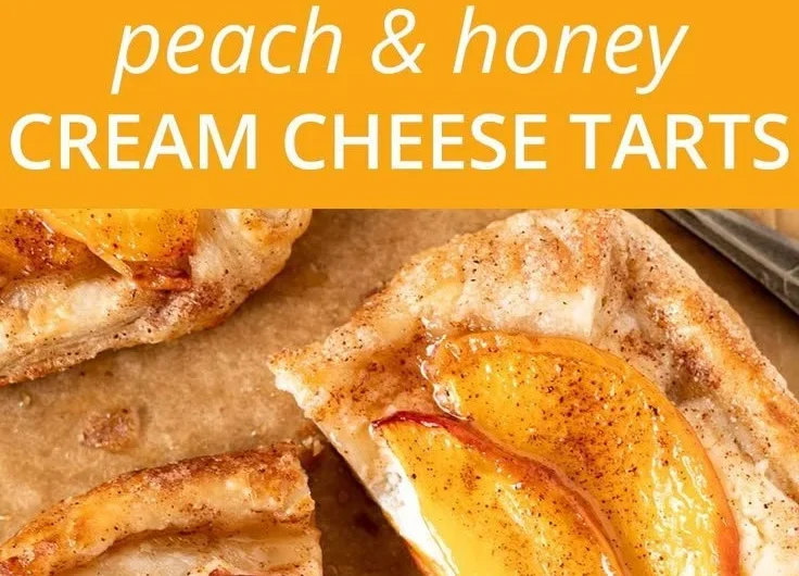 Mini peach and cream cheese tarts on a platter