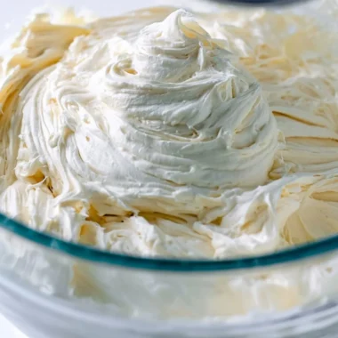 A bowl of fluffy American Buttercream icing prepared for cake decoration