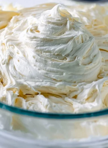 A bowl of fluffy American Buttercream icing prepared for cake decoration