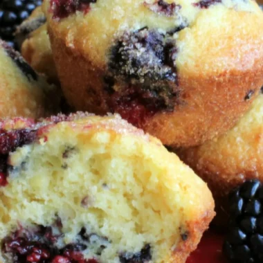 Freshly baked blackberry muffins with berries on top
