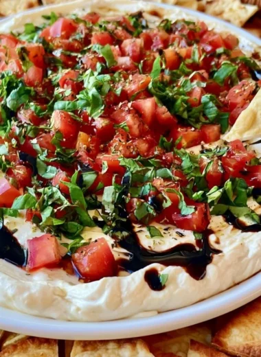 Delicious bruschetta dip served with crispy bread slices.