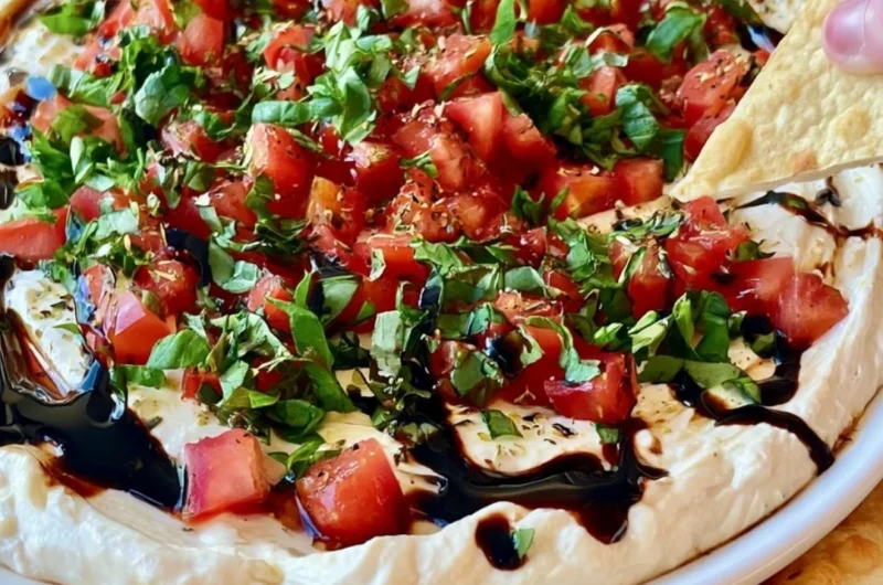 Delicious bruschetta dip served with crispy bread slices.