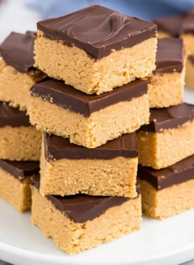 Decadent Chocolate Peanut Butter Squares on a plate, ready to enjoy.
