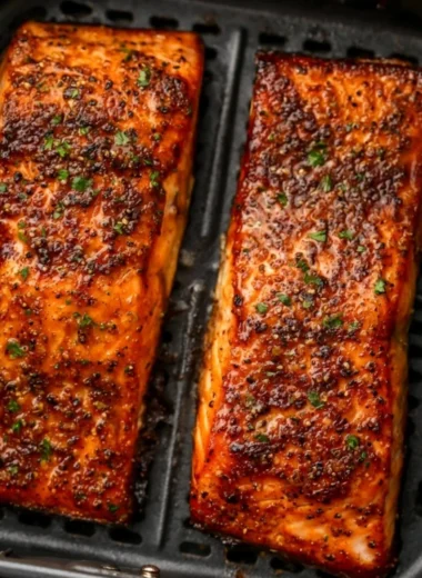 Delicious easy air fryer salmon served with lemon and herbs