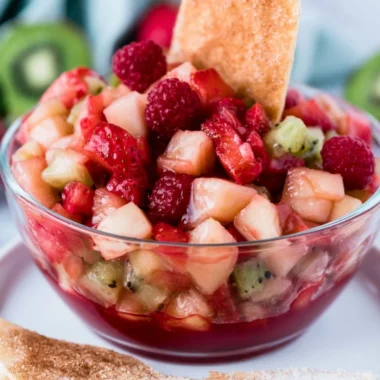 Fruit salsa served with cinnamon tortilla chips for a delicious dessert.