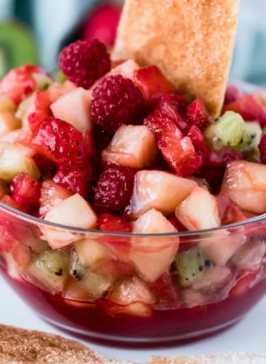 Fruit salsa served with cinnamon tortilla chips for a delicious dessert.