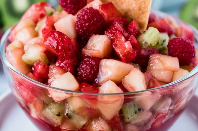 Fruit salsa served with cinnamon tortilla chips for a delicious dessert.