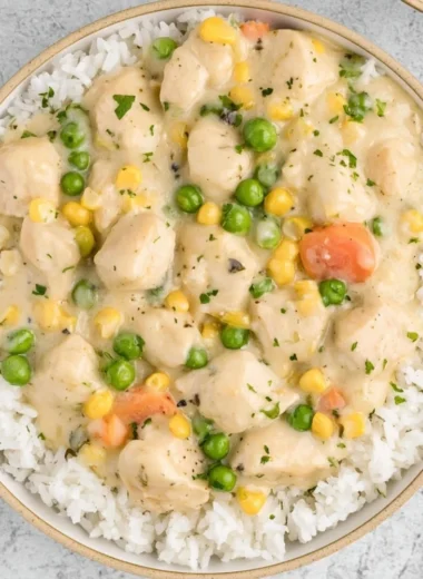 High Protein Crustless Chicken Pot Pie served in a bowl with vegetables