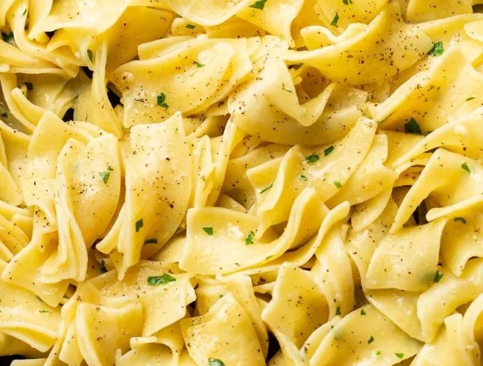Delicious hot buttered egg noodles served in a bowl