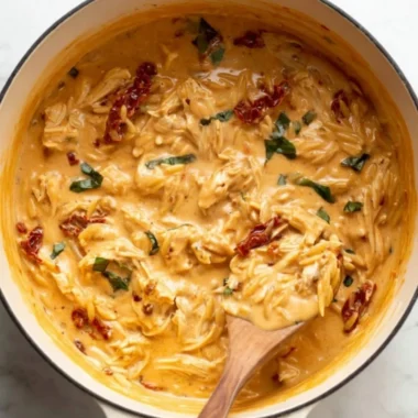Delicious Marry Me Chicken Orzo served with herbs and garnished.