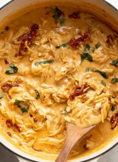 Delicious Marry Me Chicken Orzo served with herbs and garnished.