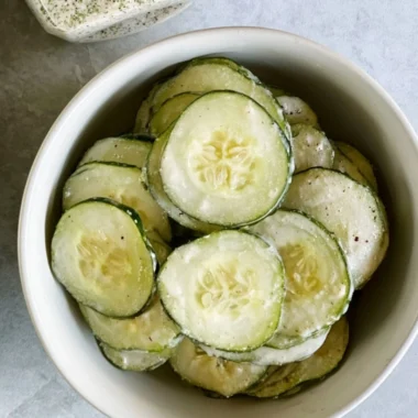 Delicious ranch cucumber chips served in a bowl, perfect for snacking.
