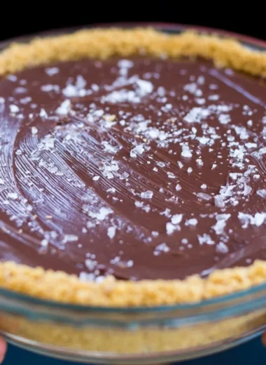 Decadent Salted Bourbon Chocolate Pie topped with sea salt, perfect for dessert lovers.