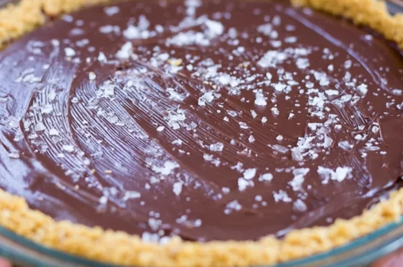 Decadent Salted Bourbon Chocolate Pie topped with sea salt, perfect for dessert lovers.