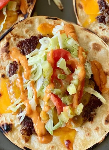 Juicy smash burger tacos served with fresh toppings and condiments.