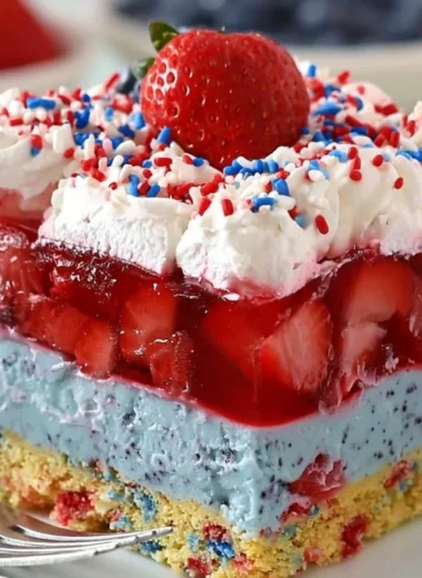 Delicious Summer Berry Dessert Lasagna with layers of cream and fresh berries