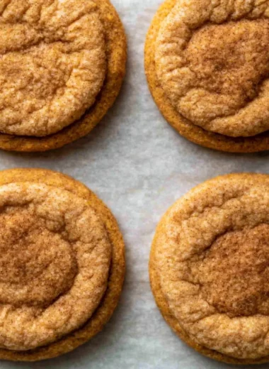 Delicious chewy pumpkin cookies on a baking sheet ready to be served