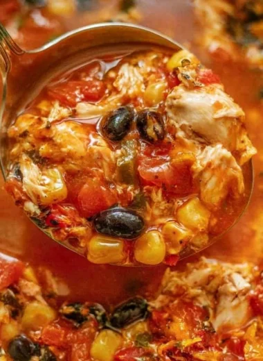 Bowl of Chicken Tortilla Soup topped with avocado and tortilla strips