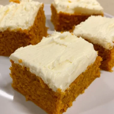 Delicious cozy pumpkin cream cheese bars with a creamy frosting on top