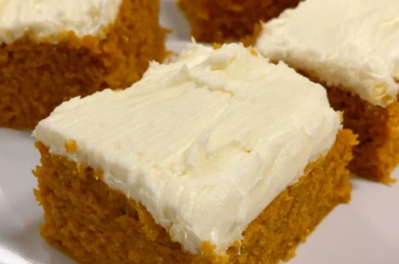 Delicious cozy pumpkin cream cheese bars with a creamy frosting on top