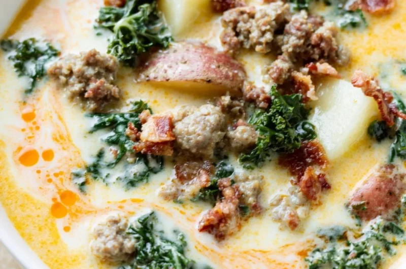 Bowl of Instant Pot Tuscan Soup garnished with fresh herbs and bread