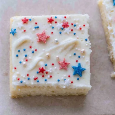 Patriotic Sugar Cookie Bars decorated with red, white, and blue sprinkles