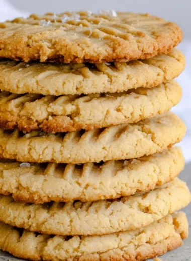 Freshly baked soft and chewy peanut butter cookies on a cooling rack
