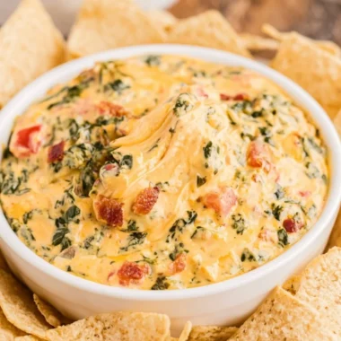 Delicious spinach dip served in a bowl with tortilla chips